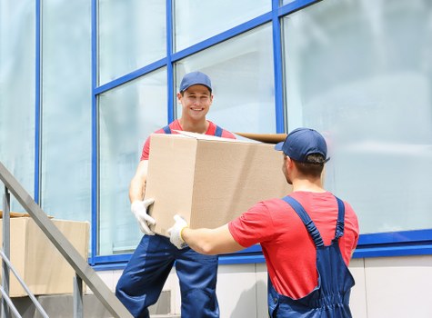 Removal team preparing a Deptford house move with boxes and furniture