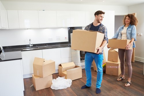 Local movers transporting bedroom furniture from a Deptford flat