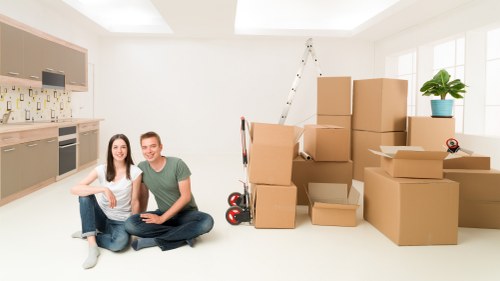 Careful loading of furniture and boxes during a same day move in Deptford