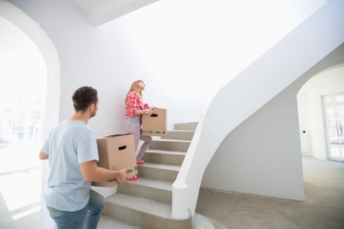 Unpacking assistance helping a family settle into a new Deptford home